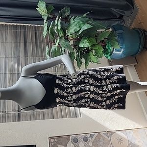 Classic little black dress with beautiful flowers. Formal prom wedding cocktail
